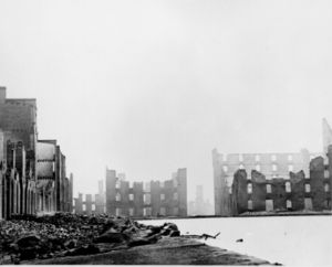 Shells of the buildings of Richmond, silhouetted against a dark sky after the destruction by Confederates fleeing advancing Union forces, 1865.