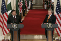 US President George W. Bush and President Musharraf answer reporters in the East Room of the White House in late 2006.