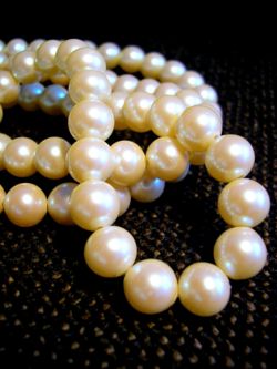 White pearls strung on a necklace