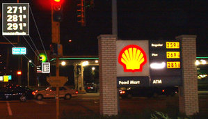 Overnight gas price hike shown at a Chicago area BP-Amoco station (background). The Shell station (foreground) has not yet posted the 12 cent price hike.