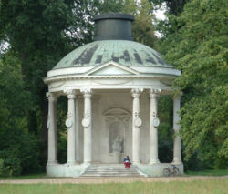 The Temple of Friendship: constructed south of the main avenue from 1768 to 1770 by Carl von Gontard in memory of Frederick the Great's  favourite sister, Margravine Wilhelmine of Bayreuth.  The building complements the Antique Temple, which lies due north of the alley.