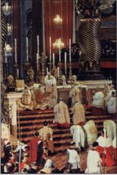 Pope John XXIII, opening the Second Vatican Council in 1962, displays the consecrated Host to those assisting at Pontifical High Mass.