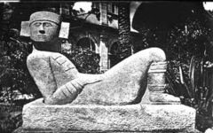 A Chac Mool statue, first identified by le Plongeon but later extensively documented by Morley's Chichen Itza excavations. This type of statue (whose purpose remains unclear, presumed to be related to ritual sacrifice) is also characteristic of Toltec sites, and thus provided a linkage between Chichen Itza and Central Mexico.