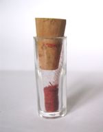 Powdered saffron stored in an airtight glass vial.