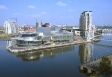 The Salford Quays, with the Lowry Centre arts complex in the centre