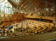 The debating chamber of the Scottish Parliament contains a shallow horseshoe of seating for the Members of the Scottish Parliament.