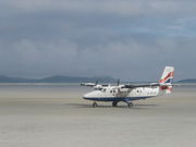 A Loganair aircraft at Barra Airport, the only airport in the world where scheduled air services land on a beach runway.