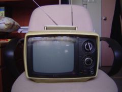 A transistor-based portable television, typical of NTSC models of the late 1960s and 1970s