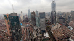 New skyscrapers amidst old residential shikumen buildings. Puxi area.