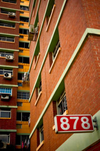 The majority of Singaporeans live in planned estates of high-rise, high-density HDB flats.
