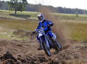 Motorcycle rider digging into soil