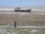 Visible salt deposits on the former bed of the Aral Sea