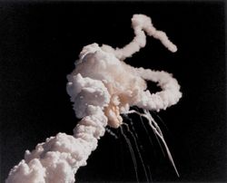 The iconic image of Space Shuttle Challenger's smoke plume after its breakup 73 seconds after launch. The accident caused the death of all seven members of the STS-51-L mission.
