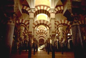 Interior of the Mezquita, a hypostyle mosque with columns arranged in grid pattern, in Córdoba, Spain