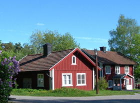 Traditional Swedish houses in the rural countryside, painted in the traditional Swedish Falu red.