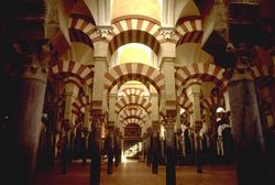Interior of the Mezquita (in Cordoba, Spain), a Roman Catholic cathedral which was formerly a mosque, the construction of which began in 784 under Abd ar-Rahman I, who fled Damascus during the Abbasid revolution.