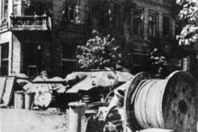Polish barricade, including captured German Hetzer tank destroyer, during the Warsaw Uprising