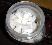Sugar cubes ready to be added to a cup of tea