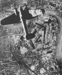 Heinkel He 111 German bomber over the Surrey Docks, Southwark, London (German propaganda photomontage)