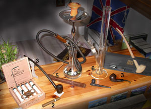 Various smoking equipment including different pipes.