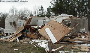 An example of F2 damage.  At this intensity, tornadoes have a more significant impact on well-built structures, damaging roofs, collapsing walls, and generating large amounts of flying debris.  This wood-frame home was unroofed, with many outer walls collapsed or destroyed.