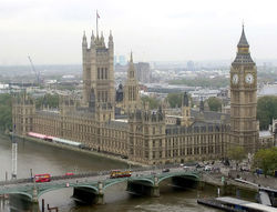The Palace of Westminster, on the banks of the River Thames, London, houses the Parliament of the United Kingdom.