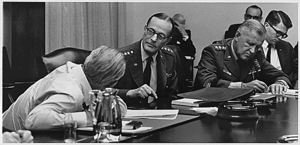 President Johnson in conversation with Chairman of the Joint Chiefs of Staff Earle Wheeler (l) and General Creighton Abrams (r)