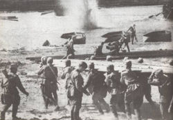 Soviet soldiers crossing the River Dneiper under withering German fire.