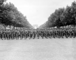 American troops march down the Champs Elysées in Paris