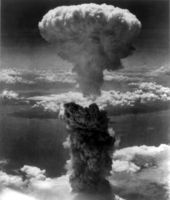 The mushroom cloud resulting from the nuclear weapon known as Fat Man rises 18 km (11 mi, 60,000 ft) over Nagasaki from the nuclear explosion hypocenter.