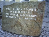 Outside the building in Braunau am Inn where Adolf Hitler was born is a memorial stone warning of the horrors of World War II.