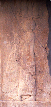 A bas-relief found at Pasargadae shows a figure thought to be Cyrus, depicted with four Assyrian wings, and wearing a horned Egyptian-like crown and a Persian dress.