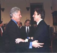 Blair embraces U.S. President (now former) Bill Clinton.