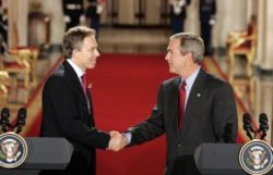 George W. Bush and Tony Blair shake hands after their press conference in the East Room of the White House on 12 November 2004.