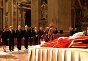 Clinton, along with Pres. George W. Bush, Laura Bush, and Pres. George H. W. Bush pay their respects to Pope John Paul II before the pope's funeral.