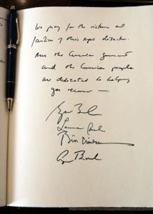 A note signed by former United States Presidents George H. W. Bush and Bill Clinton, First Lady Laura Bush, and President George W. Bush expressing their condolences during a visit to the embassy of Sri Lanka in Washington, D.C., Monday, January 3, 2005. The President wrote, “We pray for the victims and families of this epic disaster. And the American government and American people are dedicated to helping you recover.”