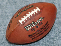 The ball used in American football has a pointed prolate spheroid or vesica piscis shape, and usually has a large set of stitches along one side.