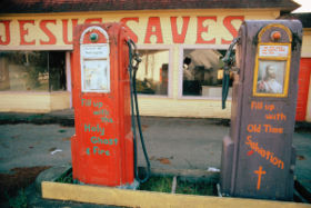 Gas stations abandoned during the fuel crisis in the winter of 1973-74 were sometimes used for other purposes. This station at Potlatch, Washington, west of Olympia was turned into a religious meeting hall.