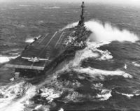 The USS Essex in heavy seas with a post-WW2 angled deck