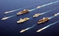 Four modern aircraft carriers of various types –  USS John C. Stennis, Charles de Gaulle, HMS Ocean and USS John F. Kennedy — and escort vessels on operations in 2002