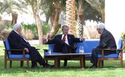 President George W. Bush, center, discusses the Middle East peace process with Prime Minister Ariel Sharon of Israel, left, and Palestinian President Mahmoud Abbas in Aqaba, Jordan, June 4, 2003.
