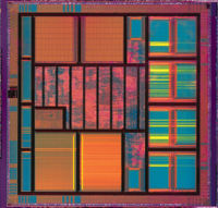 Integrated circuit showing memory blocks, logic and input/output pads around the periphery