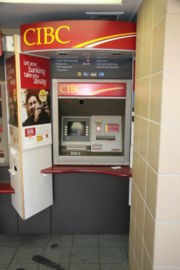 An on-premise NCR interior, multi-function through-the-wall ATM at a CIBC branch in Canada