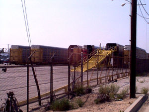 Autoracks wait to be unloaded in a BNSF Railway facility in Los Angeles, California.