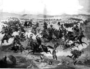 General Custer on horseback and his U. S. Army troops make their last charge at the Battle of the Little Bighorn.