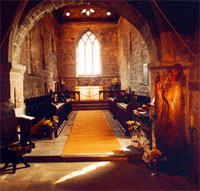 Saxon chancel of the monastic church of St. Paul, Jarrow, with (right) a modern statue of Bede