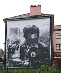 A boy in a gas mask during the Battle of the Bogside.