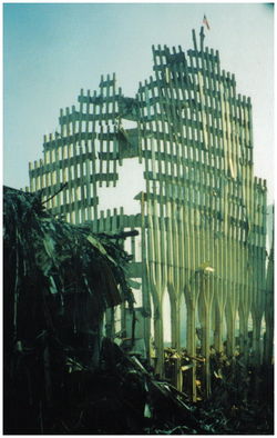 The outer skin of Tower Two remained standing and had to be demolished during the cleanup. WTC 3 is to the left.