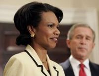 Condoleezza Rice speaks after being nominated to be Secretary of State by President George W. Bush (background)