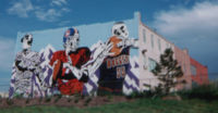Denver's professional sports teams are illustrated in this mural covering the rear of a building in 1995, just before the Avalanche of the NHL began play.